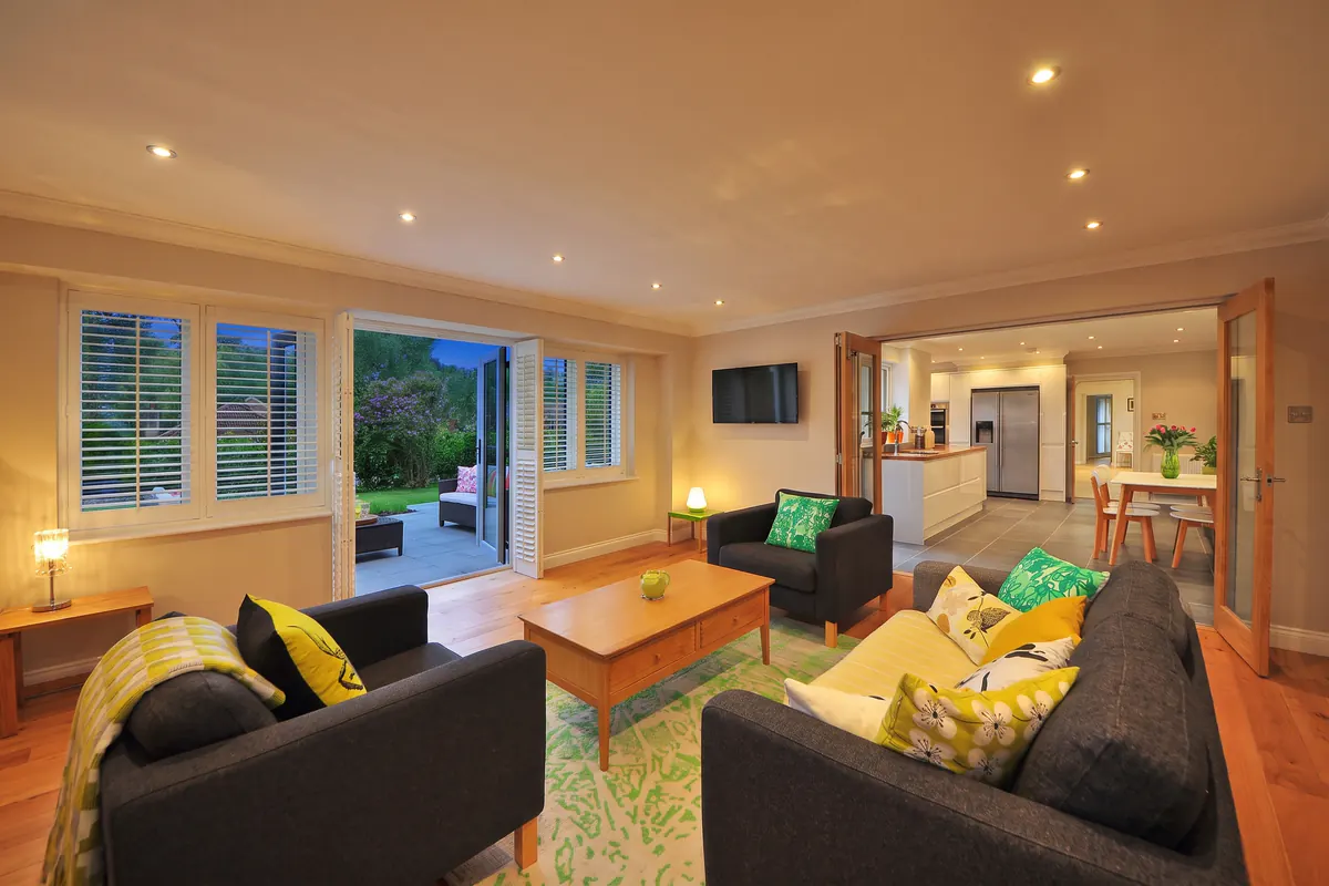 A daytime living room relit for 22:00 — after